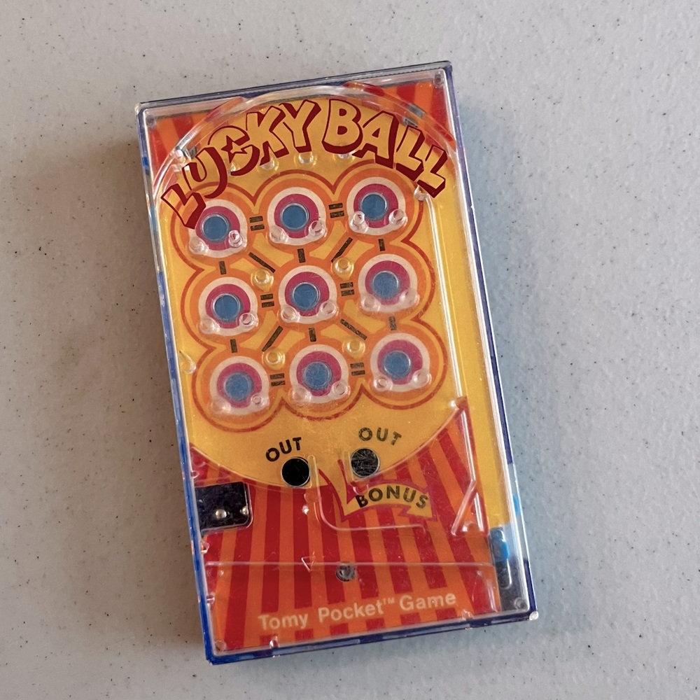 Vintage 70s hand held Lucky Ball game, good used condition.